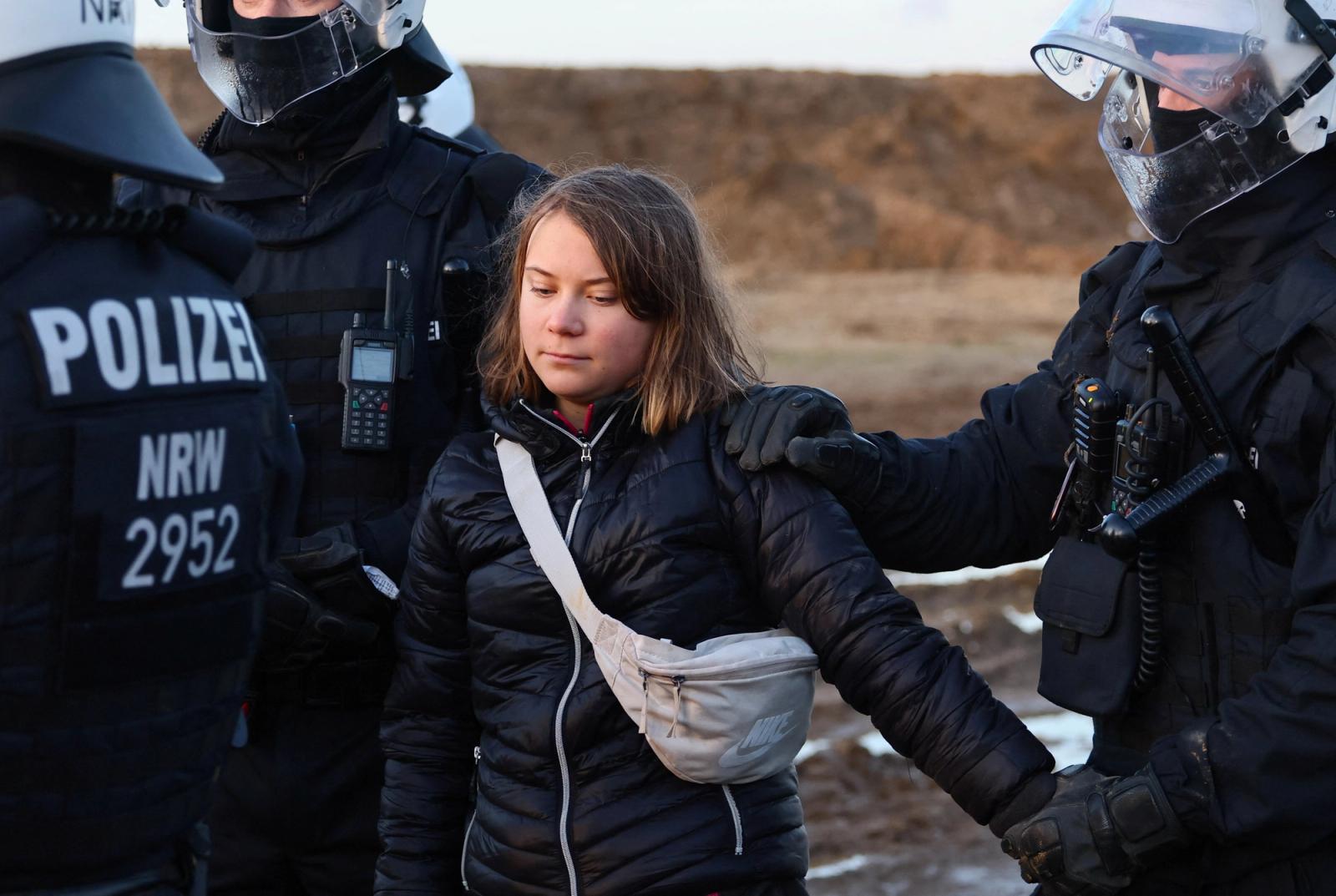 Police officers detain climate activist Greta Thunberg on the day of a protest against the expansion of the Garzweiler open-cast lignite mine of Germany's utility RWE to Luetzerath, in Germany, January 17, 2023.