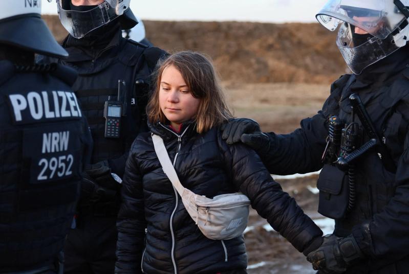 Police officers detain climate activist Greta Thunberg on the day of a protest against the expansion of the Garzweiler open-cast lignite mine of Germany’s utility RWE to Luetzerath, in Germany, January 17, 2023.