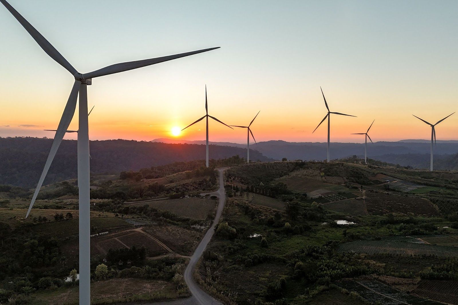 A drone view shows wind turbines operate at a wind farm in Thailand.