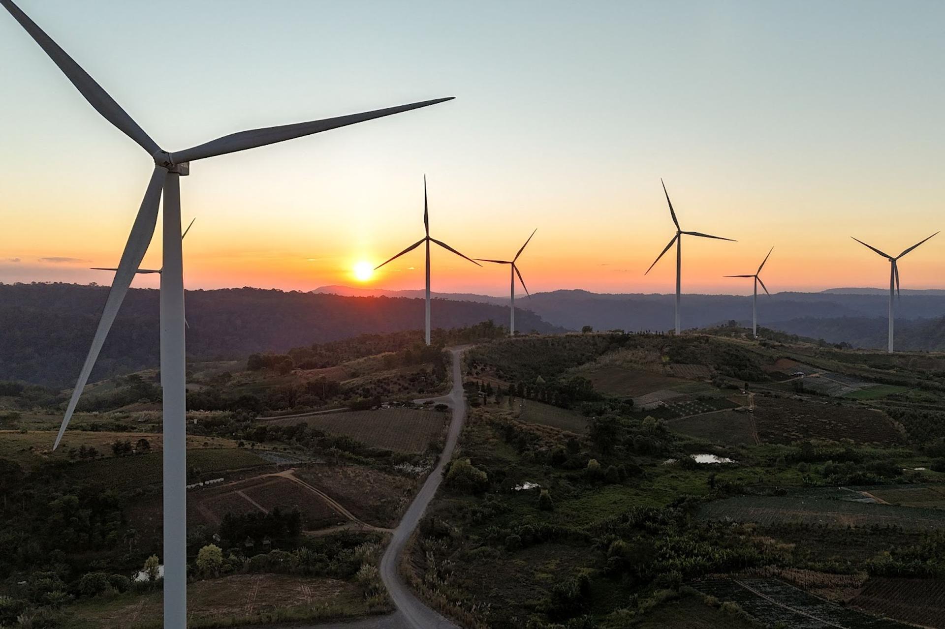 A drone view shows wind turbines operate at a wind farm in Thailand.