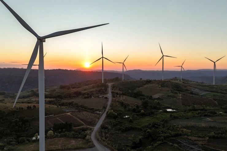 A drone view shows wind turbines operate at a wind farm in Thailand.