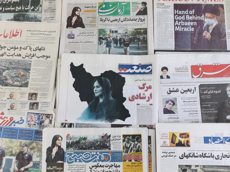 Newspapers, with a cover picture of Mahsa Amini, are seen in Tehran, Iran September 18, 2022.