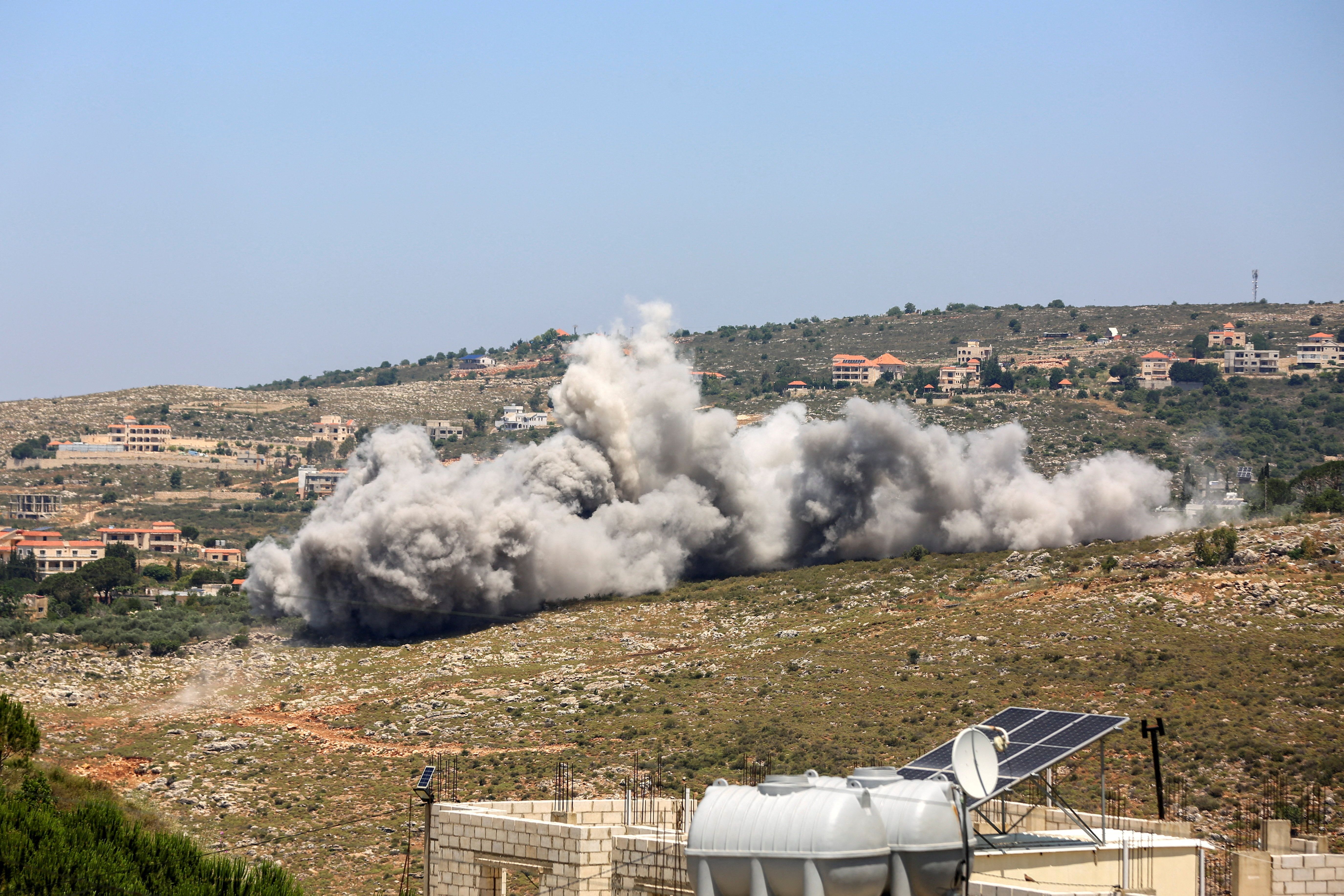 Smoke rises following an Israeli strike as seen from Houmine El Faouqa, southern Lebanon