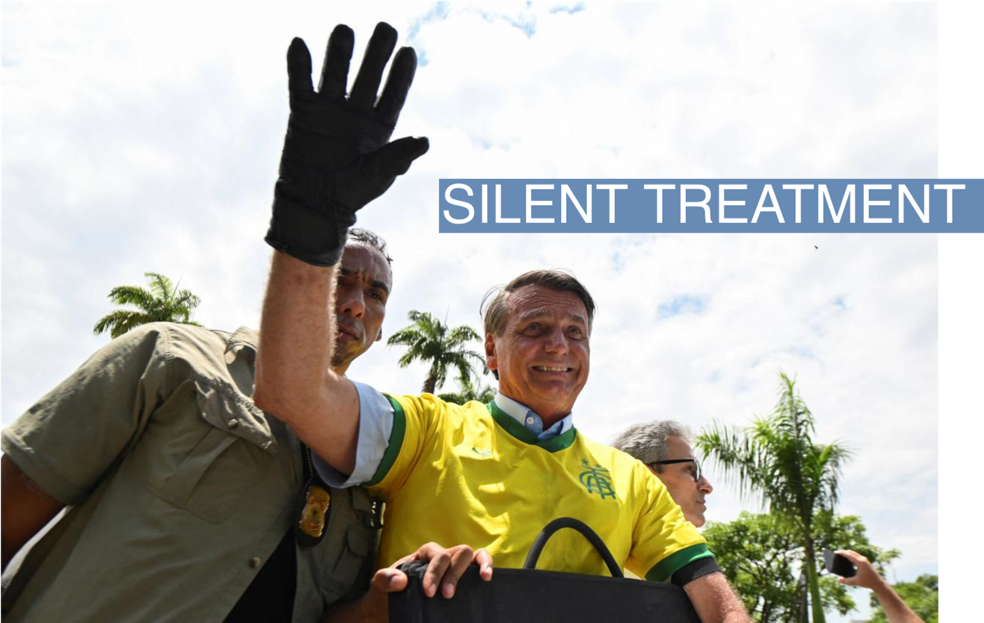 Brazil's President and candidate for re-election Jair Bolsonaro gestures during a motorcade in Belo Horizonte, Brazil