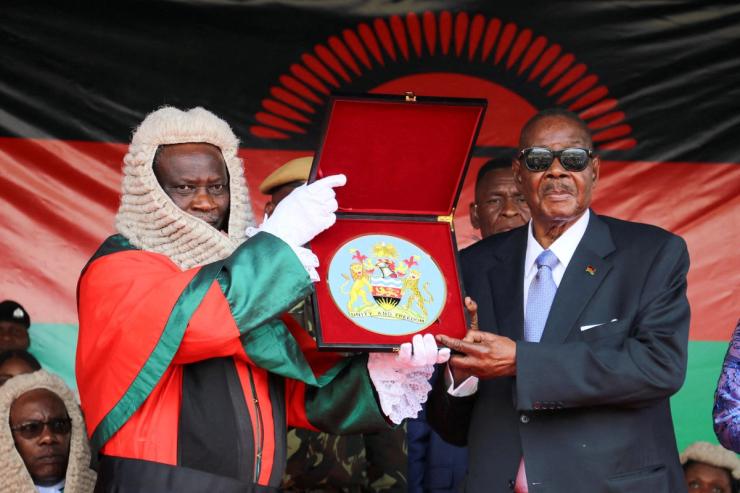 Peter Mutharika (right) is sworn in as the newly elected seventh president of Malawi.