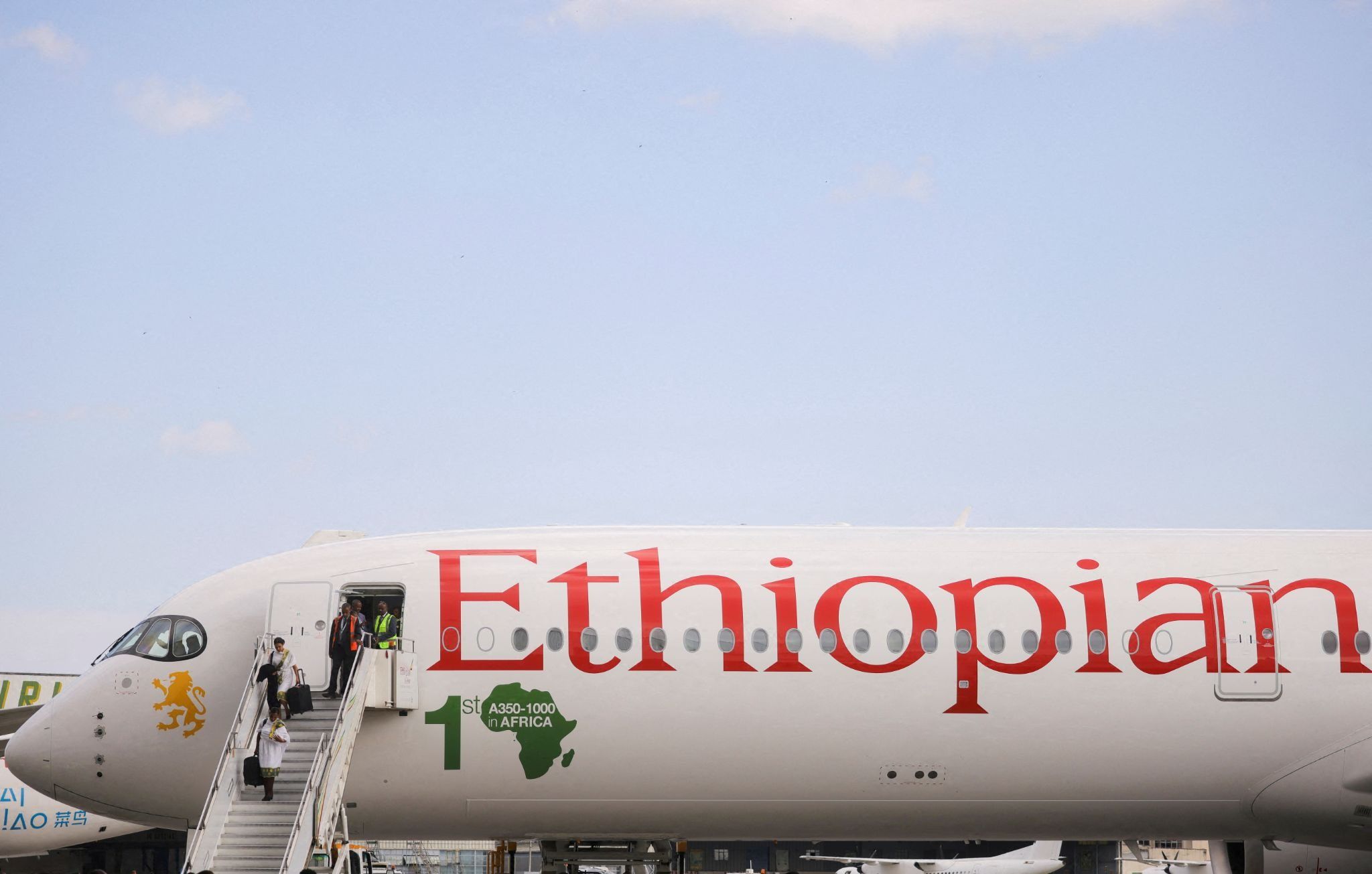 Ethiopian Airlines cabin crew disembark Ethiopia’s first Airbus A350-1000 passenger plane.