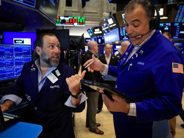 Traders work on the floor at the New York Stock Exchange (NYSE) in New York City.