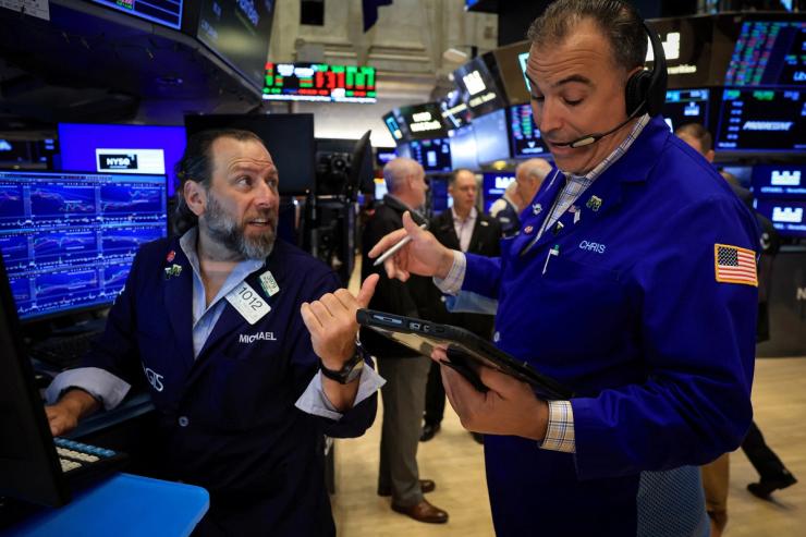 Traders work on the floor at the New York Stock Exchange (NYSE) in New York City.
