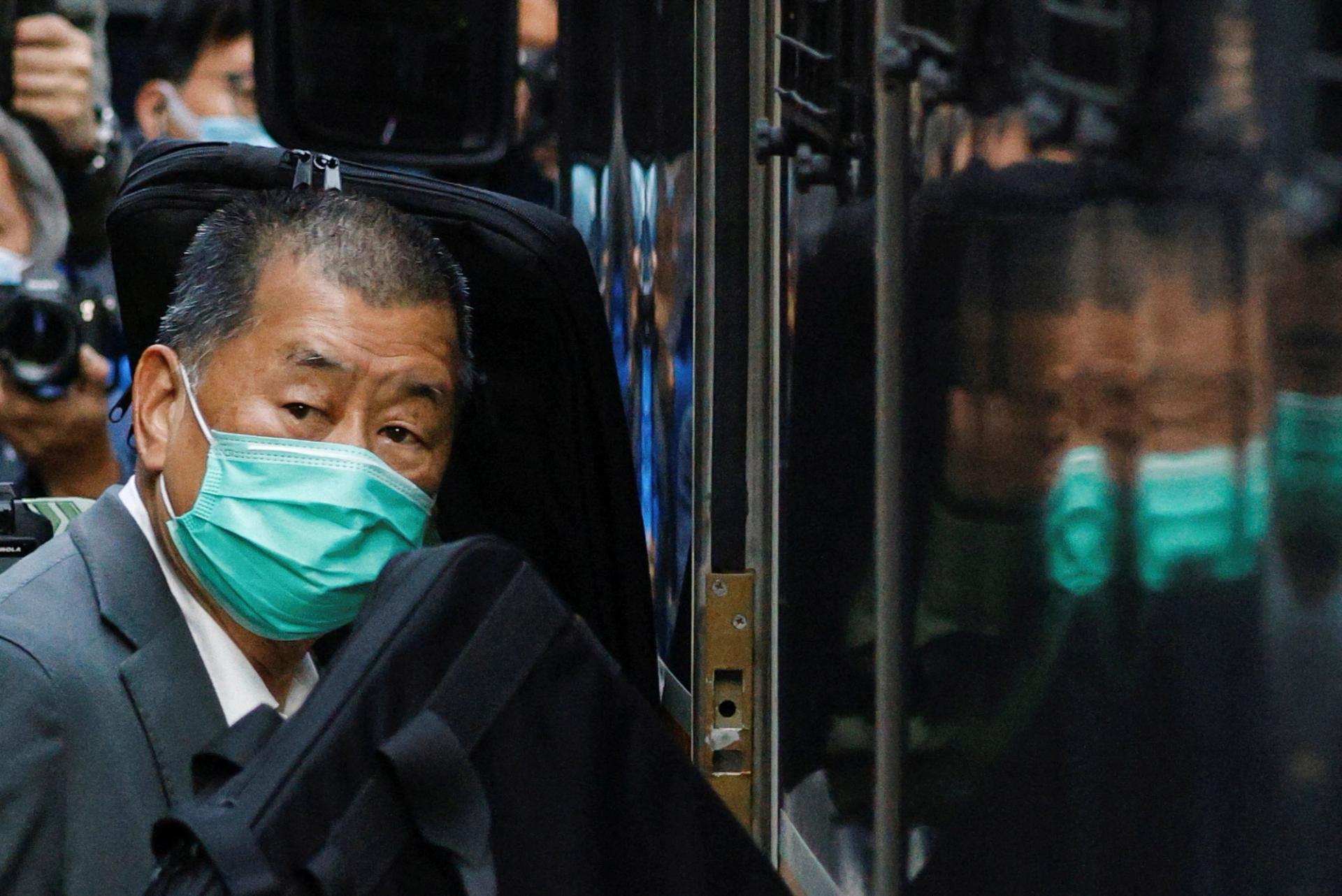 Media tycoon Jimmy Lai, founder of Apple Daily, looks on as he leaves the Court of Final Appeal by prison van, in Hong Kong on February 1, 2021.