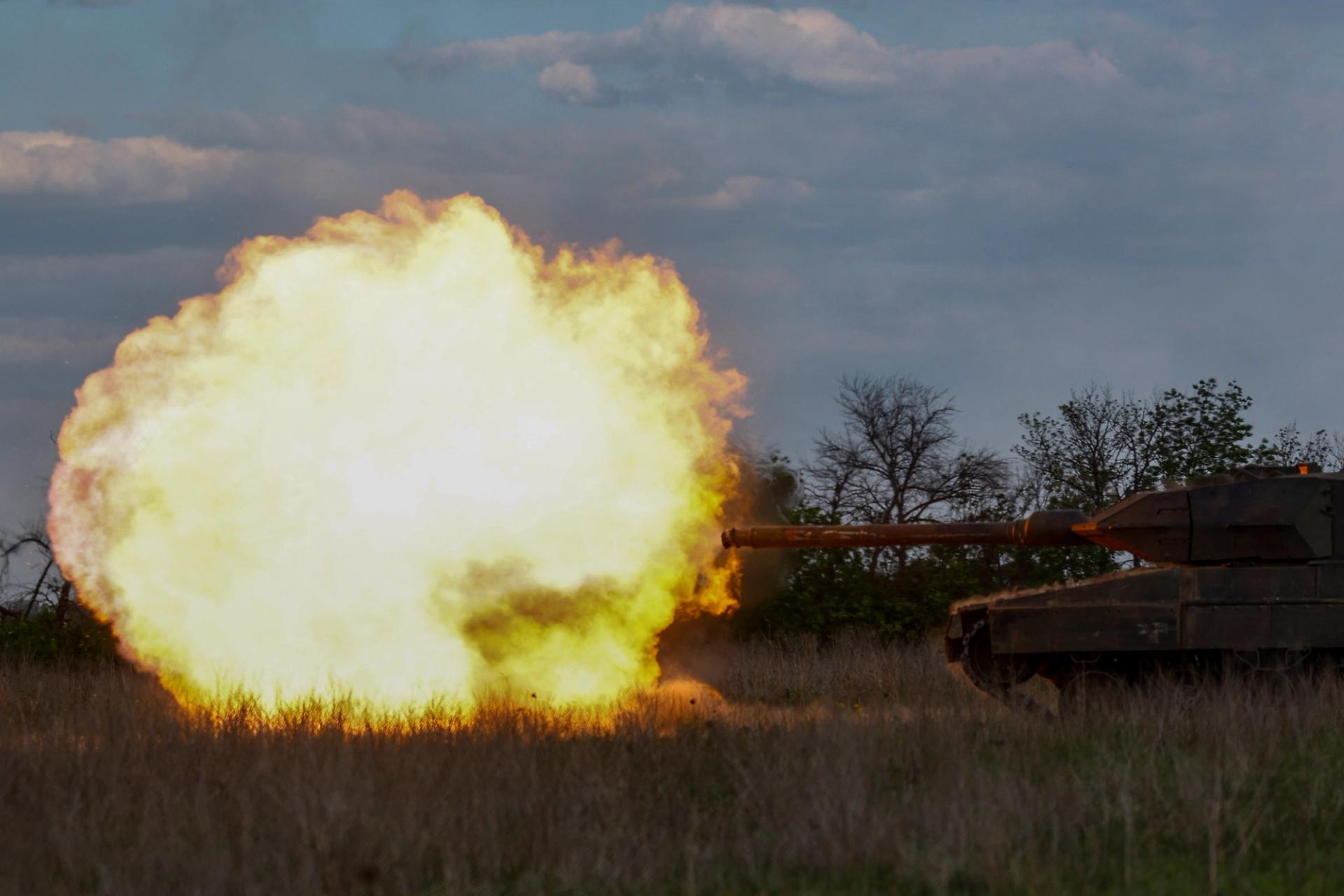 Ukrainian servicemen fire a Leopard tank during a military exercise in Ukraine.