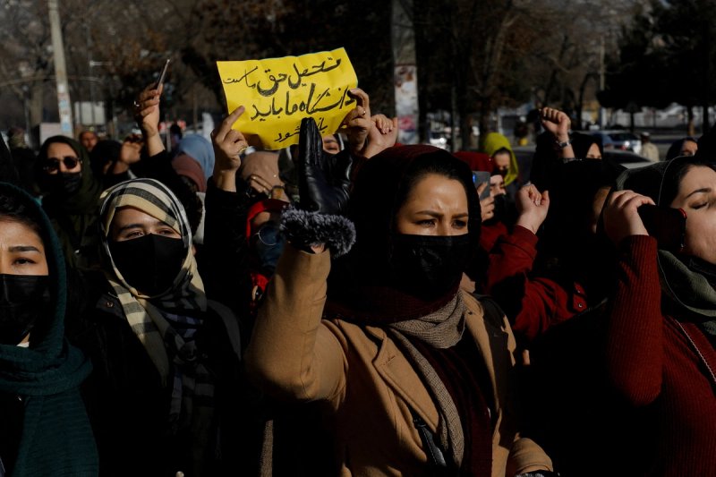 Afghan women chant slogans in protest against the closure of universities to women by the Taliban in Kabul, Afghanistan, December 22, 2022.