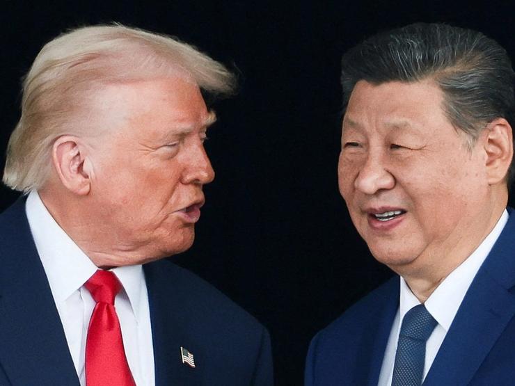 U.S. President Donald Trump and Chinese President Xi Jinping talk as they leave after a bilateral meeting at Gimhae International Airport, on the sidelines of the Asia-Pacific Economic Cooperation (APEC) summit, in Busan, South Korea