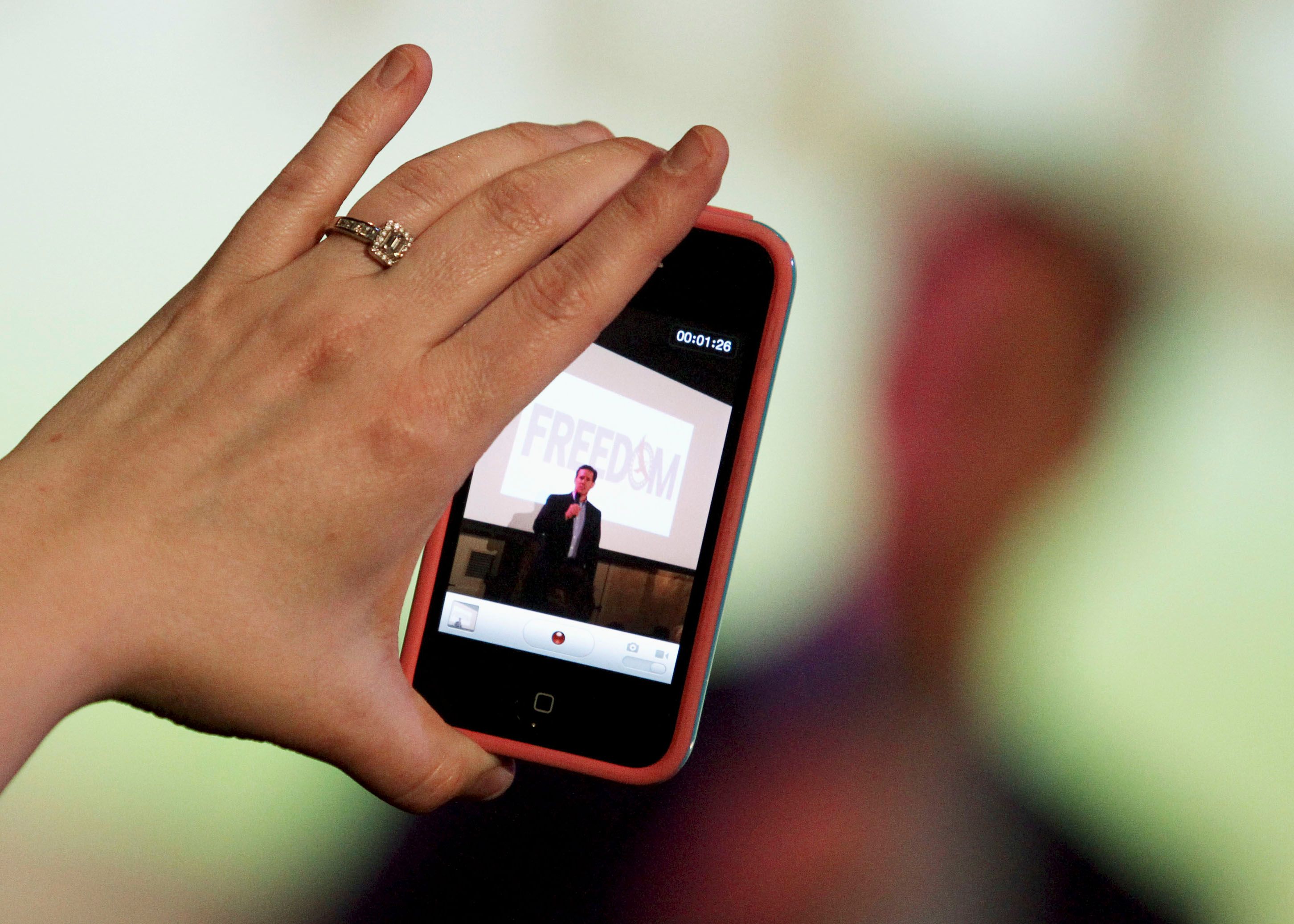 A woman films vertical video