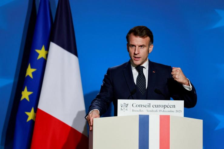 French President Emmanuel Macron holds a press conference during a European Union leaders’ summit.