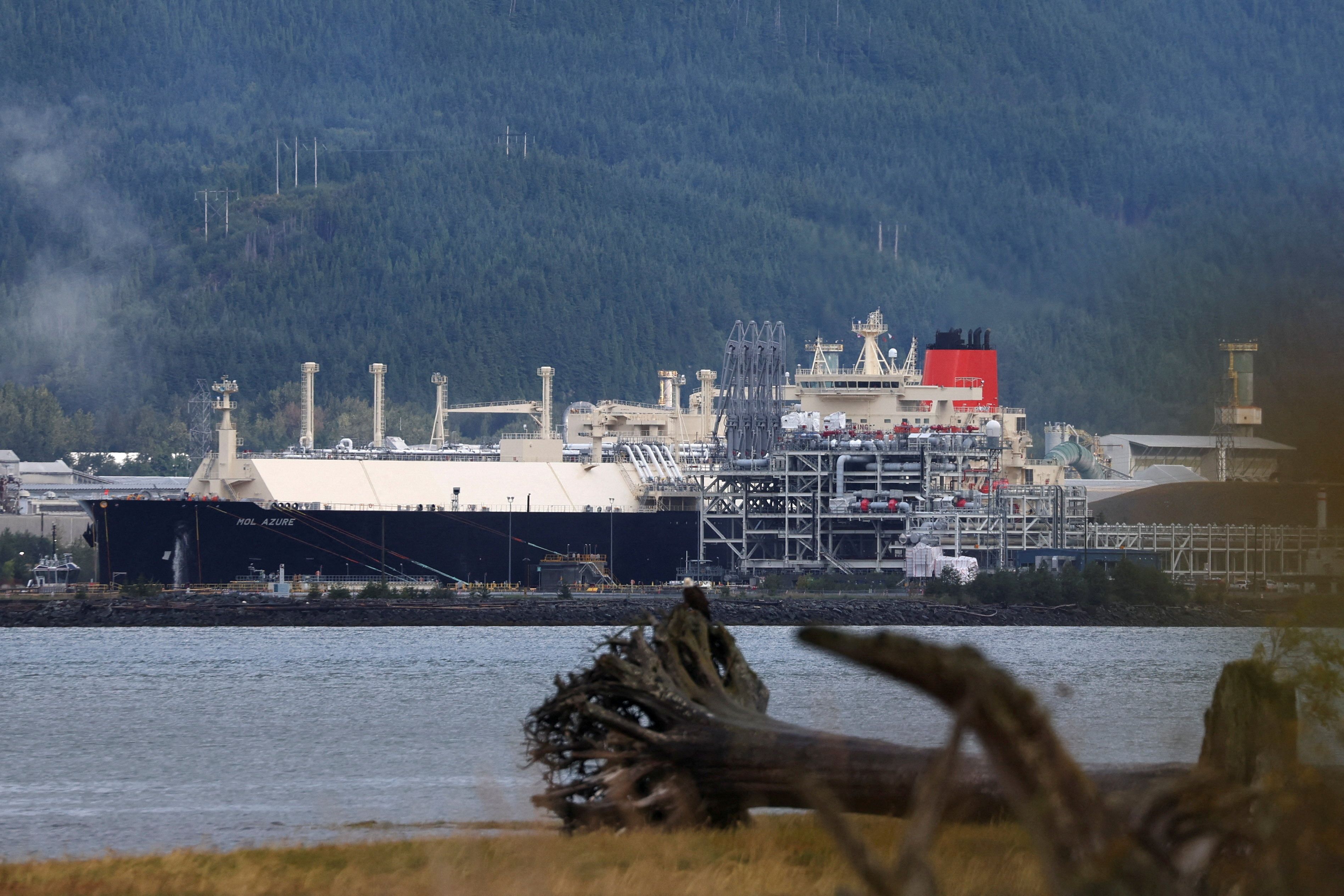 An LNG (liquid natural gas) carrier ship is docked.