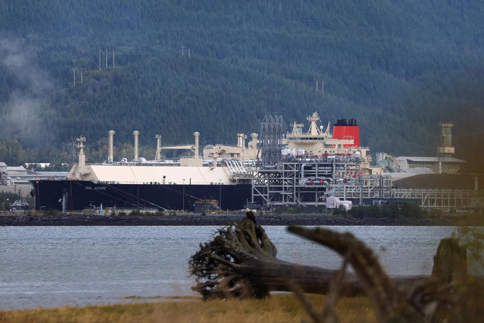 An LNG (liquid natural gas) carrier ship is docked.
