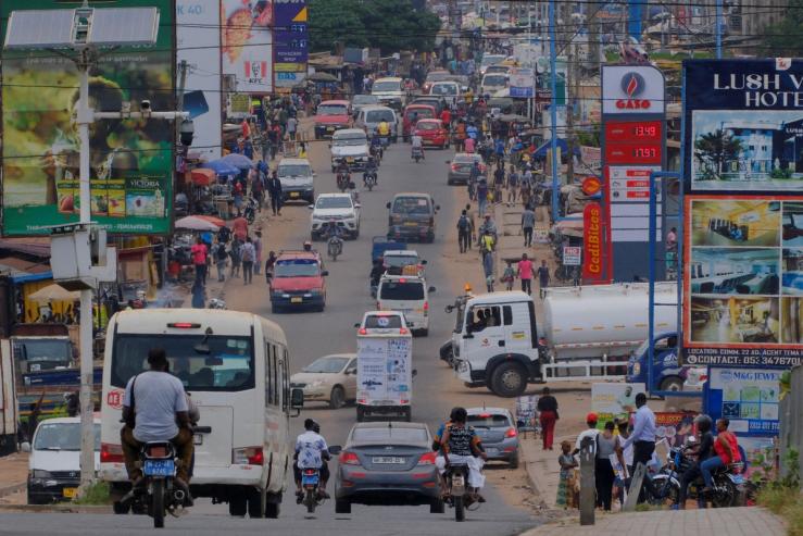 A GASO Petroleum Limited signage displays prices of petrol and diesel near a street in Tema, Ghana.
