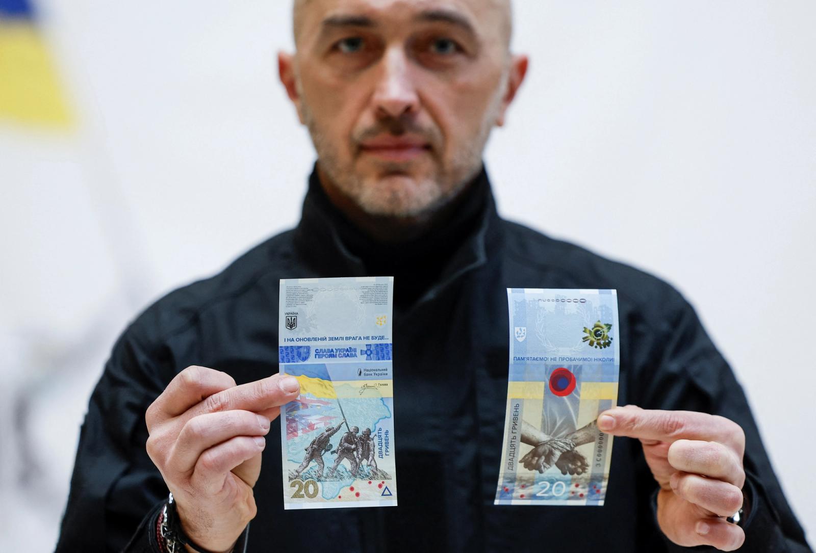 Banknotes dedicated to the first anniversary of Russia's invasion on Ukraine are seen during a presentation at the Ukrainian National Bank in Kyiv, Ukraine February 23, 2023. 