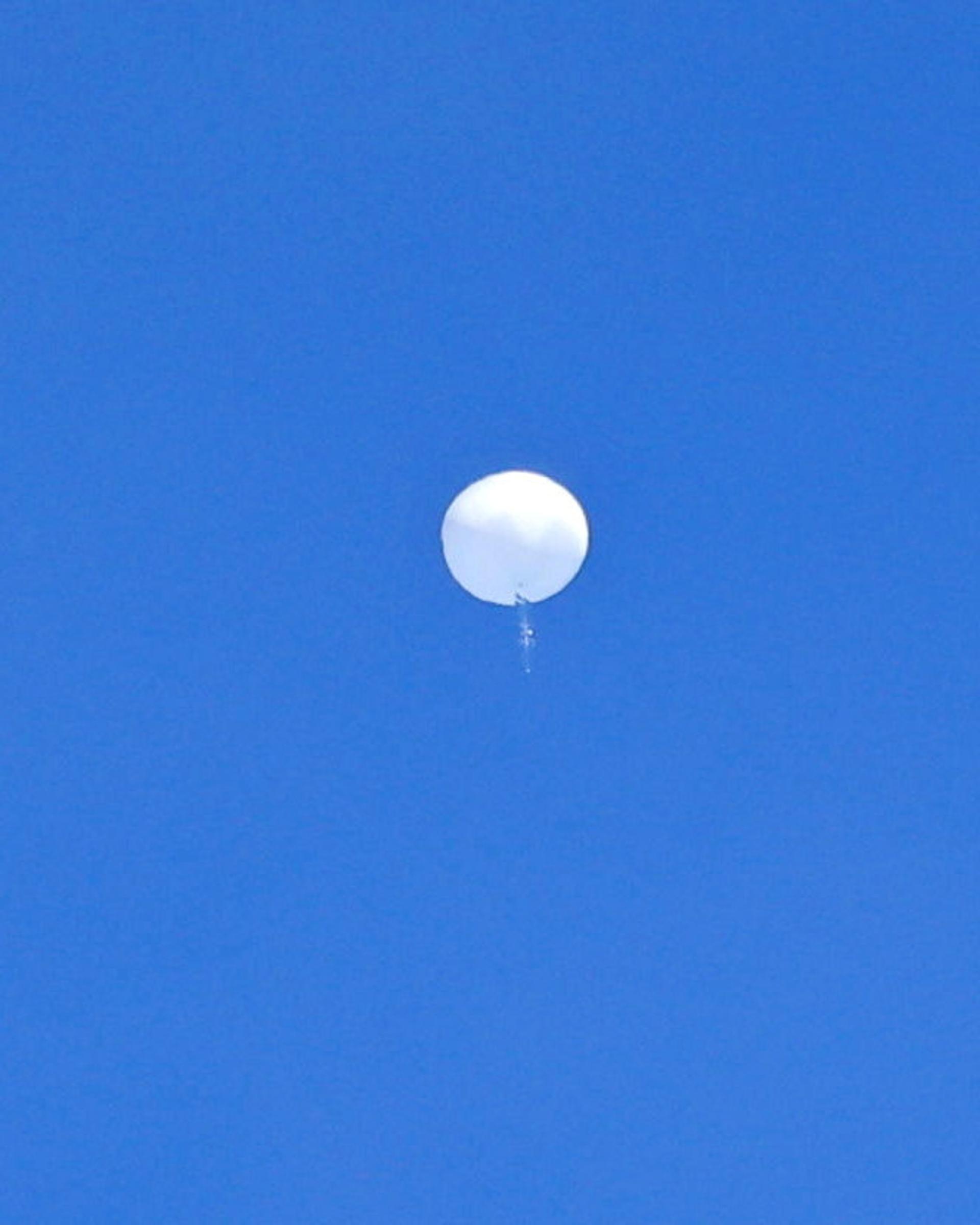 A suspected Chinese spy balloon is seen before it was shot down off the coast of Garden City, South Carolina, U.S. February 4, 2023