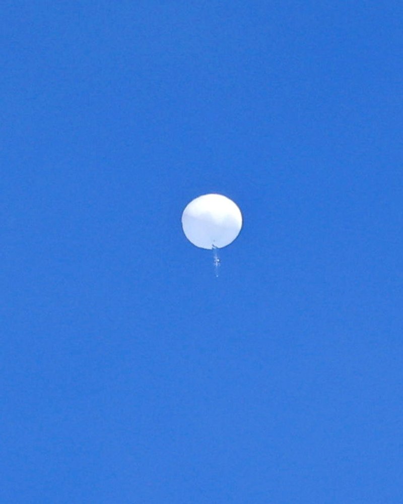 A suspected Chinese spy balloon is seen before it was shot down off the coast of Garden City, South Carolina, U.S. February 4, 2023