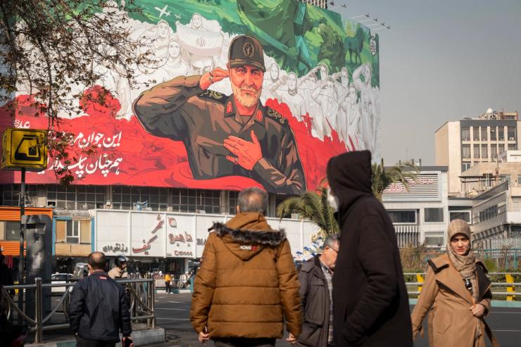 A billboard depicting symbolic images of the former commander of the Islamic Revolutionary Guard Corps (IRGC) Quds Force, Major General Qassem Soleimani, and Iranian athletes is hung on a state building in downtown Tehran, Iran