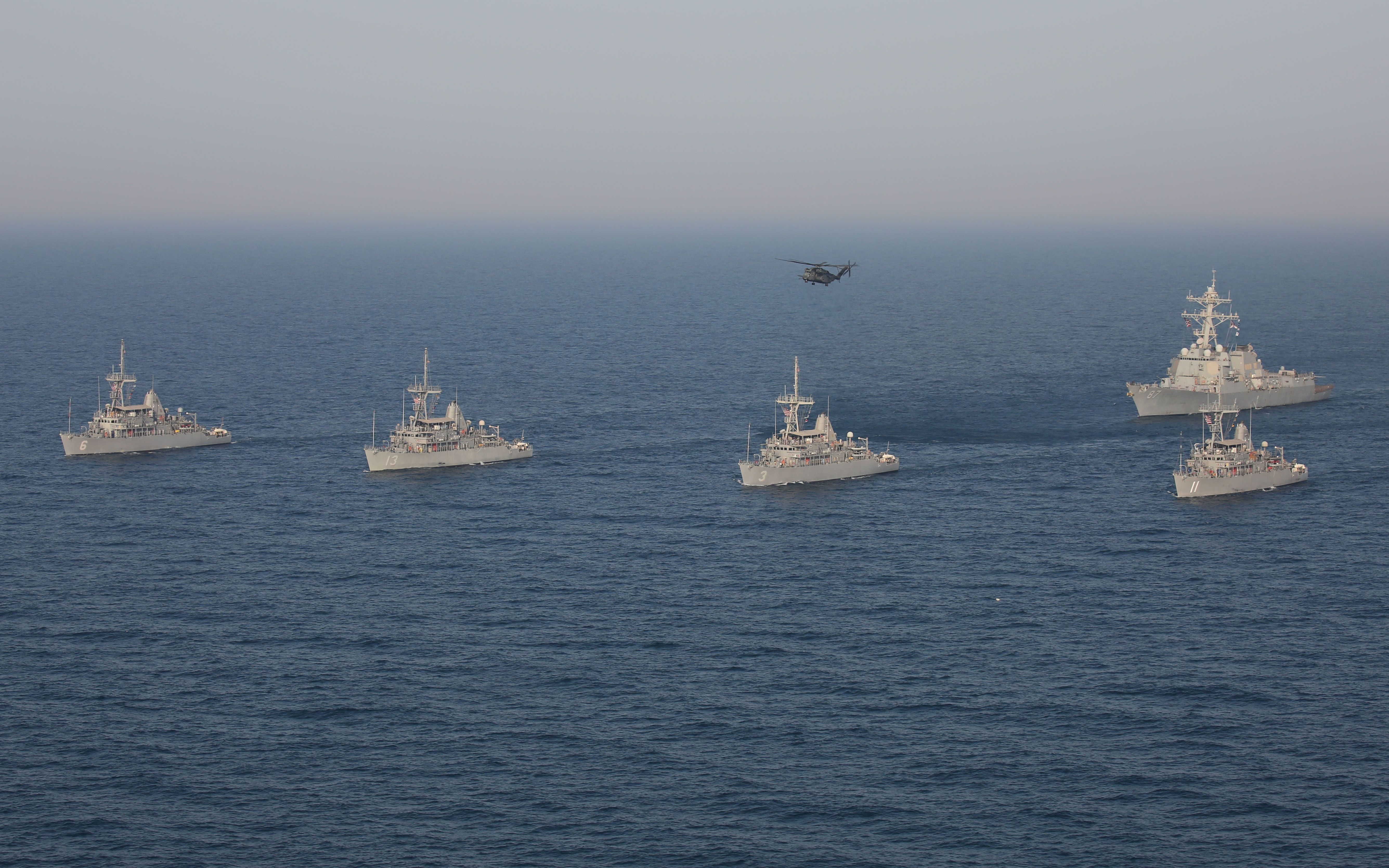 A formation of Avenger-class mine countermeasure ships