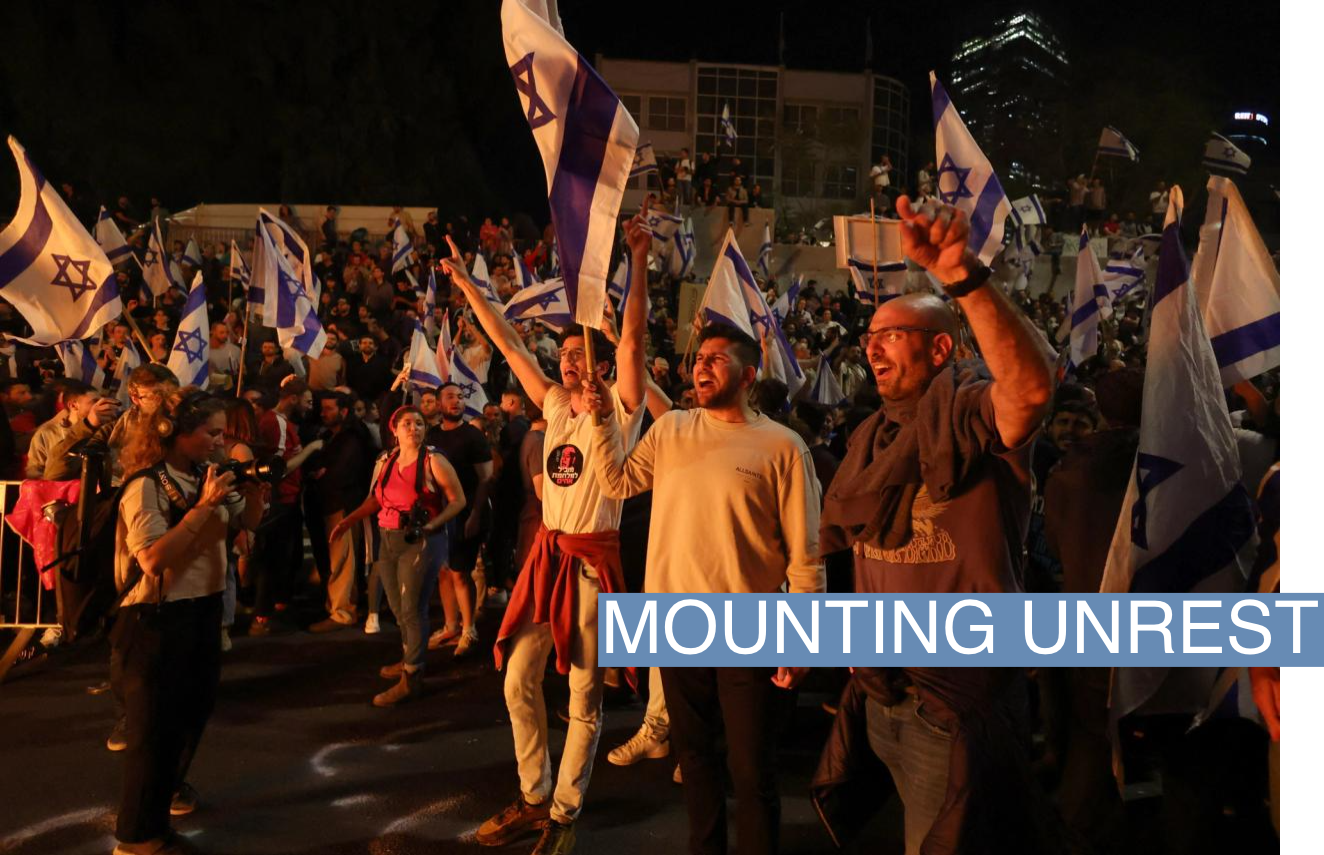 People attend a demonstration after Israeli Prime Minister Benjamin Netanyahu dismissed the defense minister and his nationalist coalition government presses on with its judicial overhaul, in Tel Aviv, Israel, March 26, 2023. REUTERS/Nir Elias