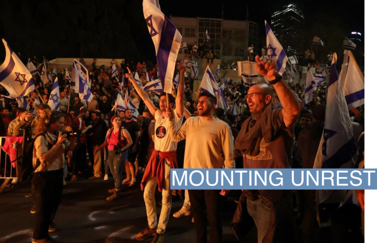 People attend a demonstration after Israeli Prime Minister Benjamin Netanyahu dismissed the defense minister and his nationalist coalition government presses on with its judicial overhaul, in Tel Aviv, Israel, March 26, 2023. REUTERS/Nir Elias