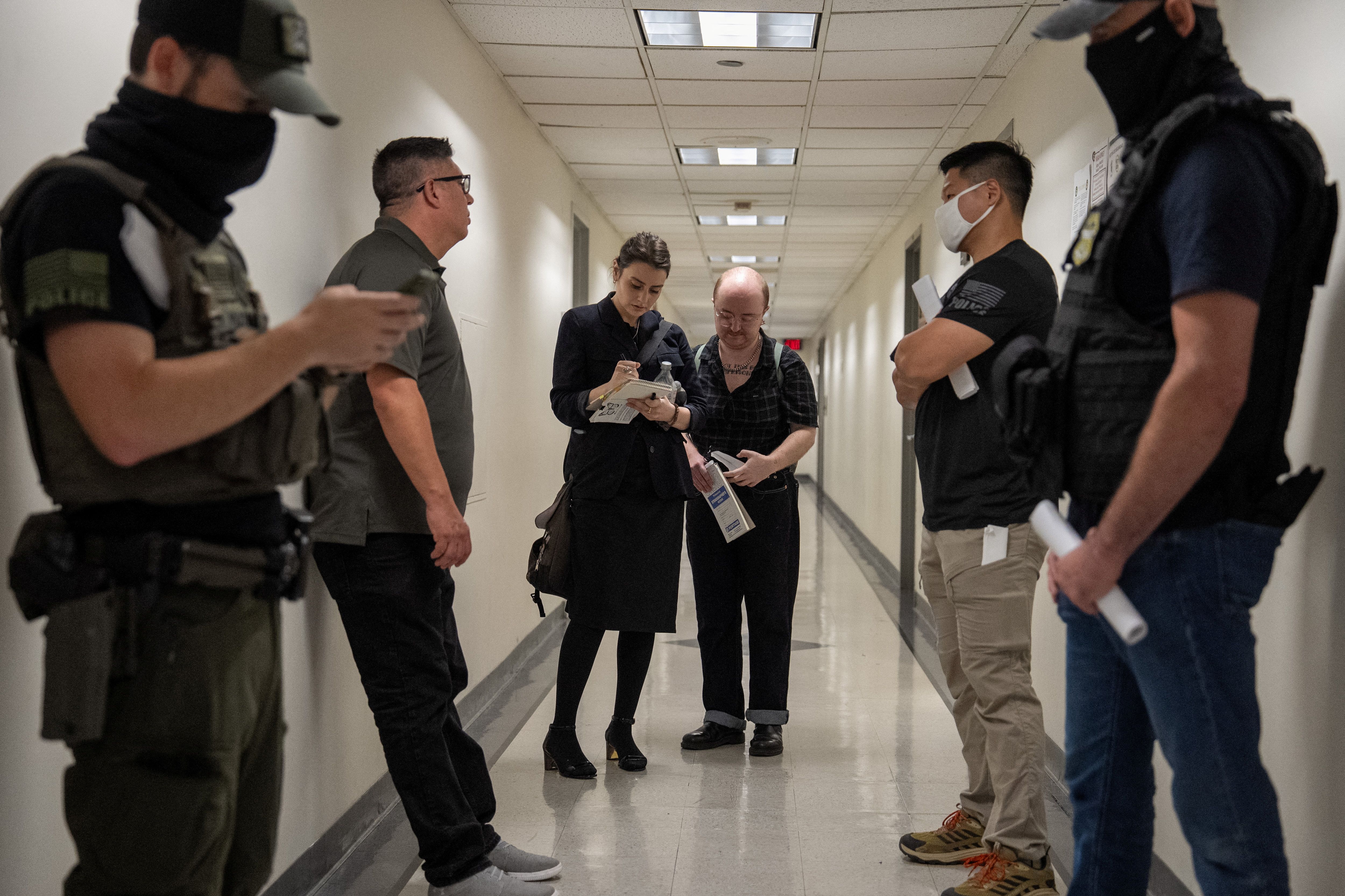 Legal observers document federal immigration officers’ badge numbers at U.S. immigration court
