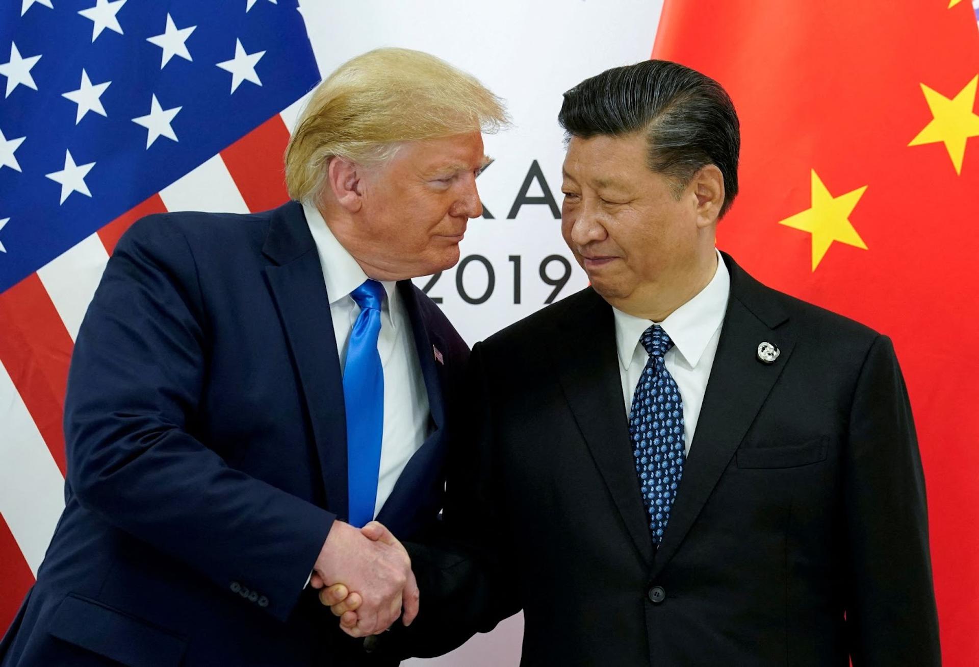 Trump and Xi shake hands in 2019.