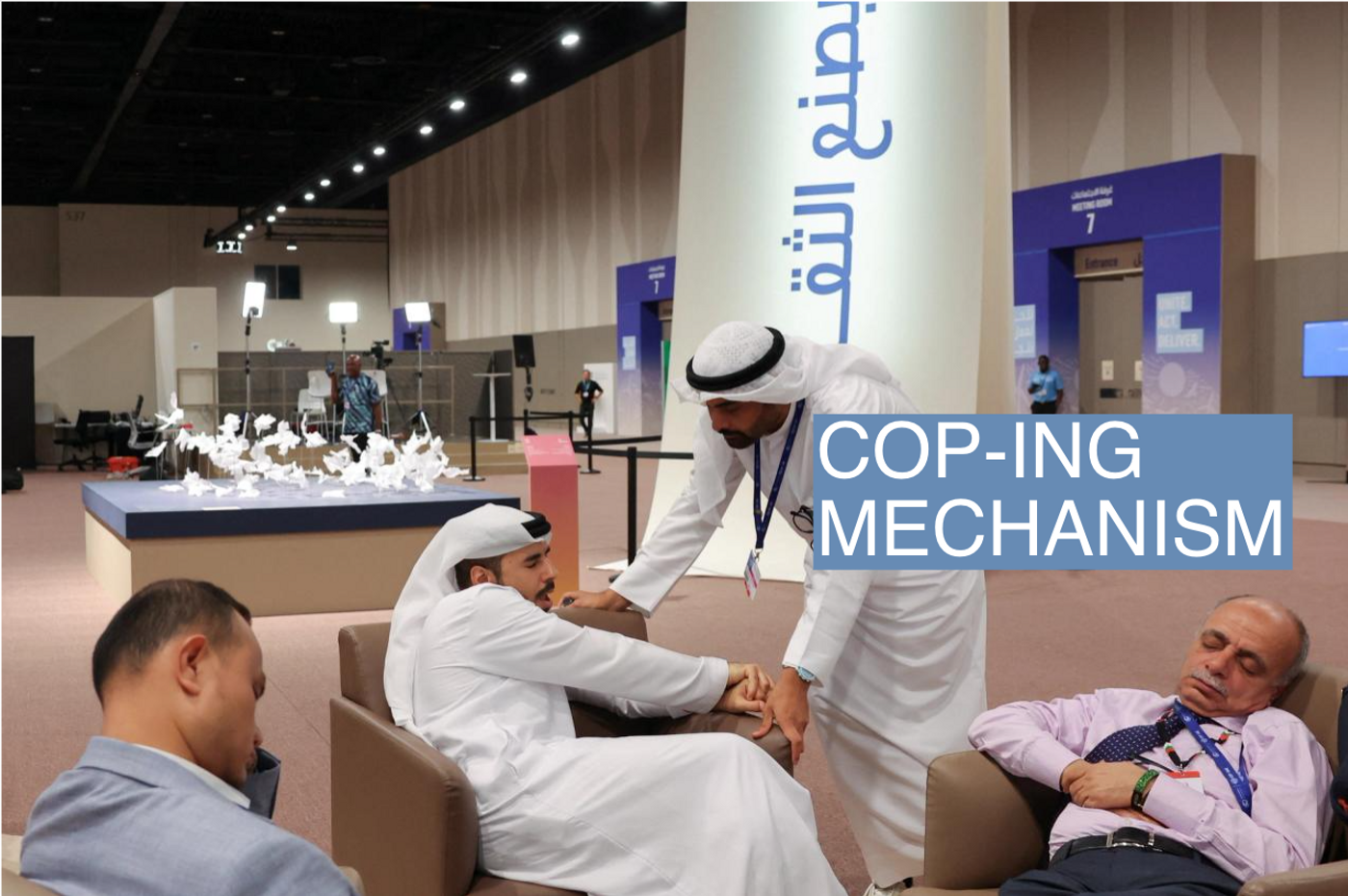 Men talk, as draft of COP28 deal is negotiated at the same time, during the United Nations Climate Change Conference (COP28) in Dubai.