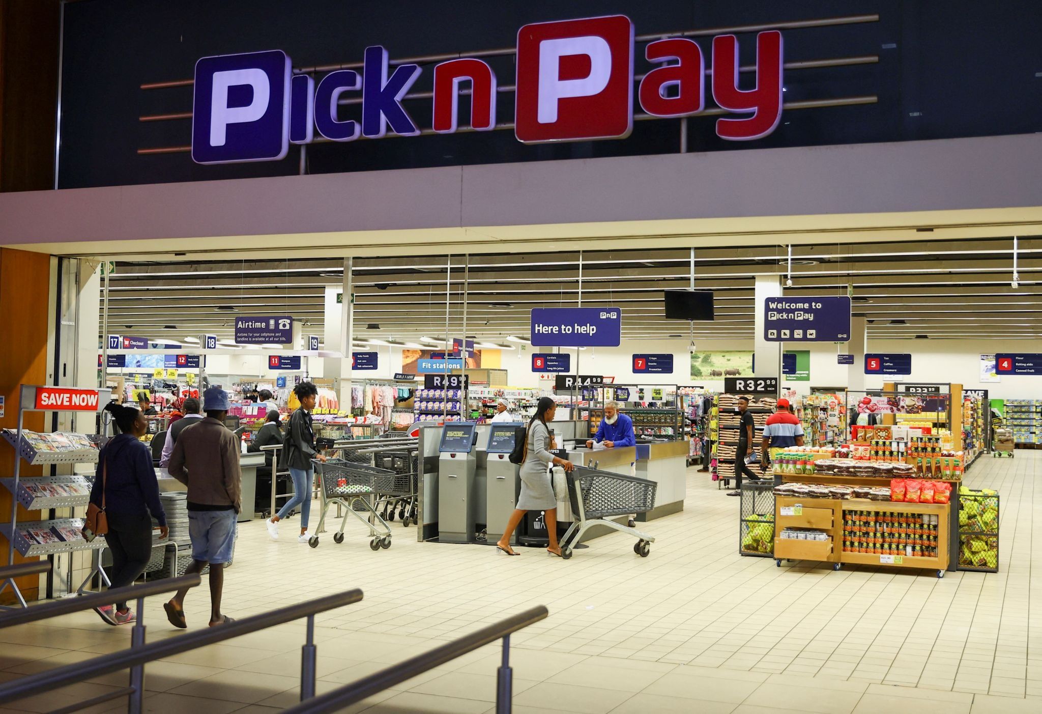 Customers push trolleys as they shop at a Pick n Pay store in Johannesburg.