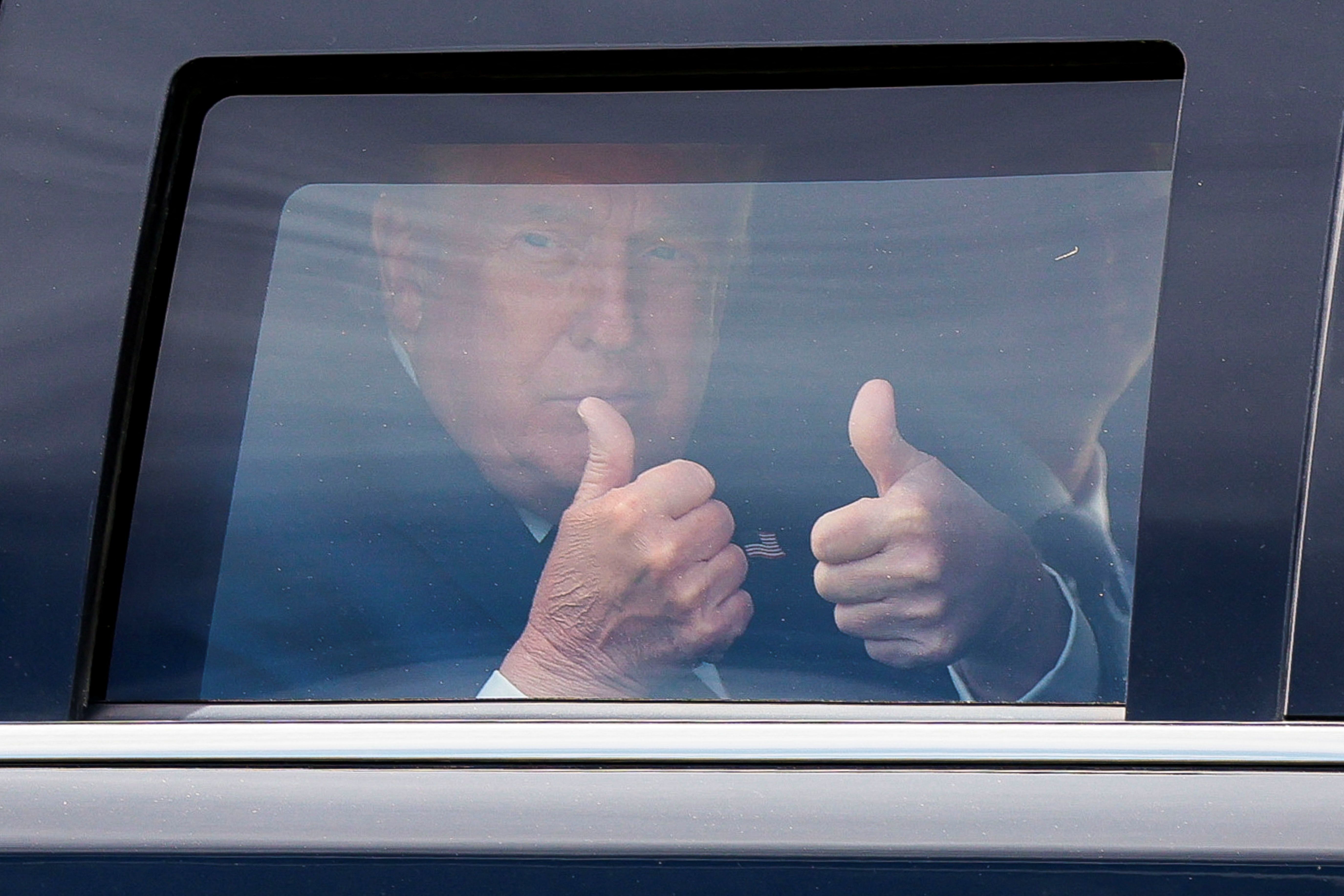 US President Donald Trump gives a thumbs up