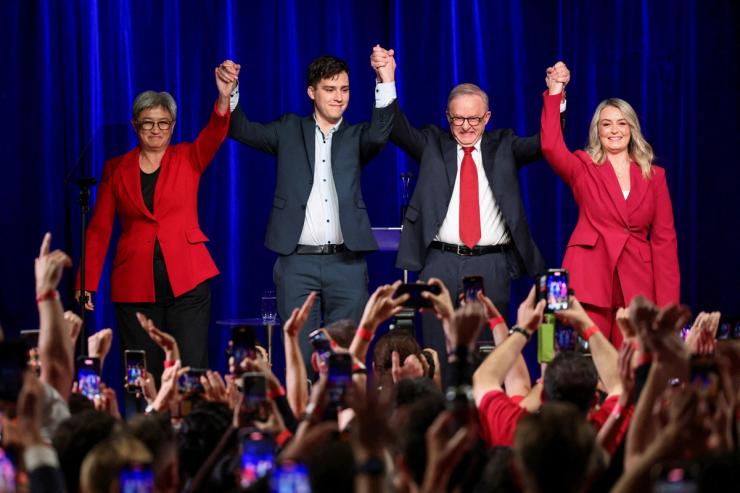 Australia’s Prime Minister Anthony Albanese celebrates with his partner Jodie Haydon, his son Nathan Albanese and Minister for Foreign Affairs Penny Wong at a Labor party election night event
