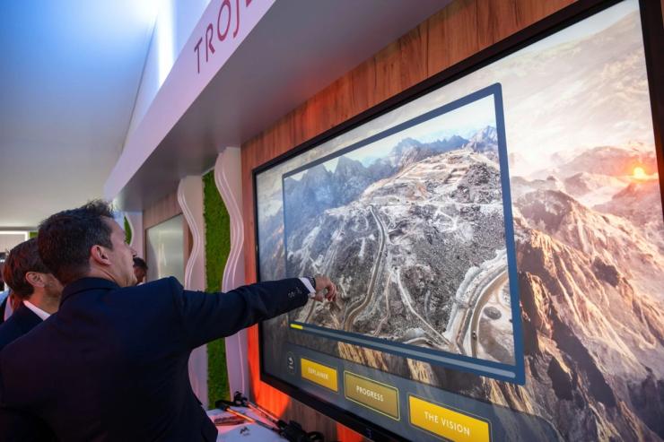 Businessmen watch an on-screen presentation of Saudi Arabia’s Trojena project at the MIPIM in Cannes.