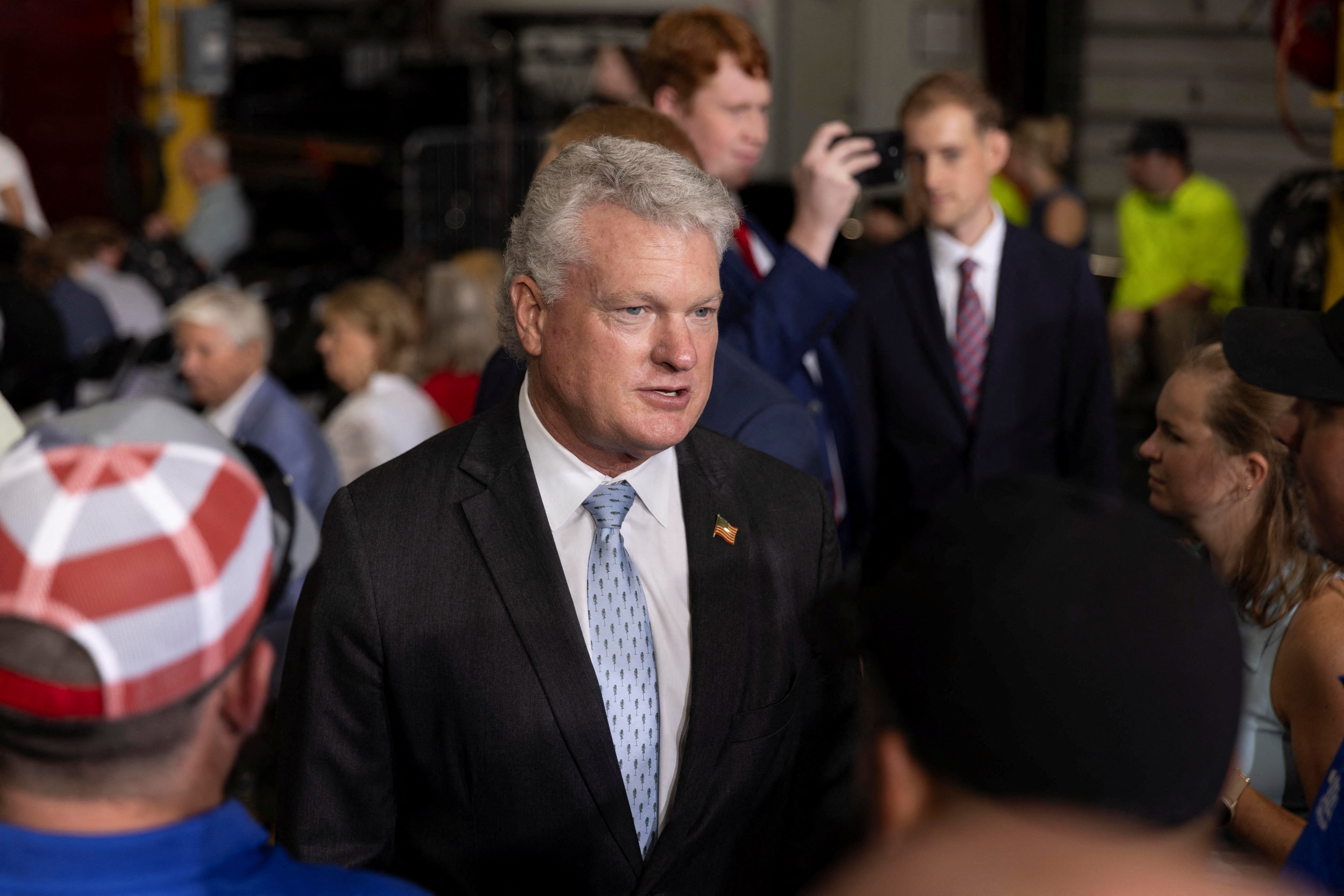U.S. Representative Mike Collins (R-GA) speaks with attendees during a Republican political event about the One Big Beautiful Bill at ALTA Refrigeration in Peachtree City, Georgia
