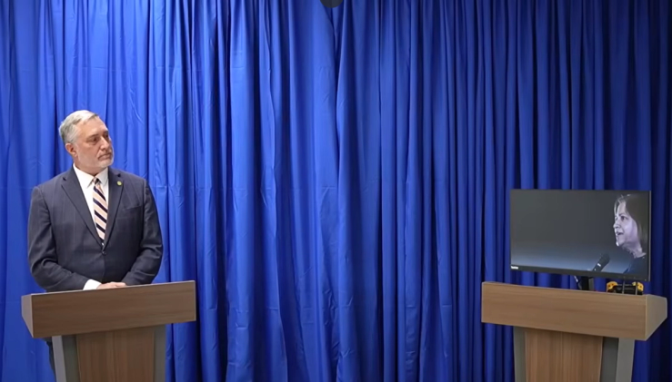 John Reid debating an AI version of his opponent.