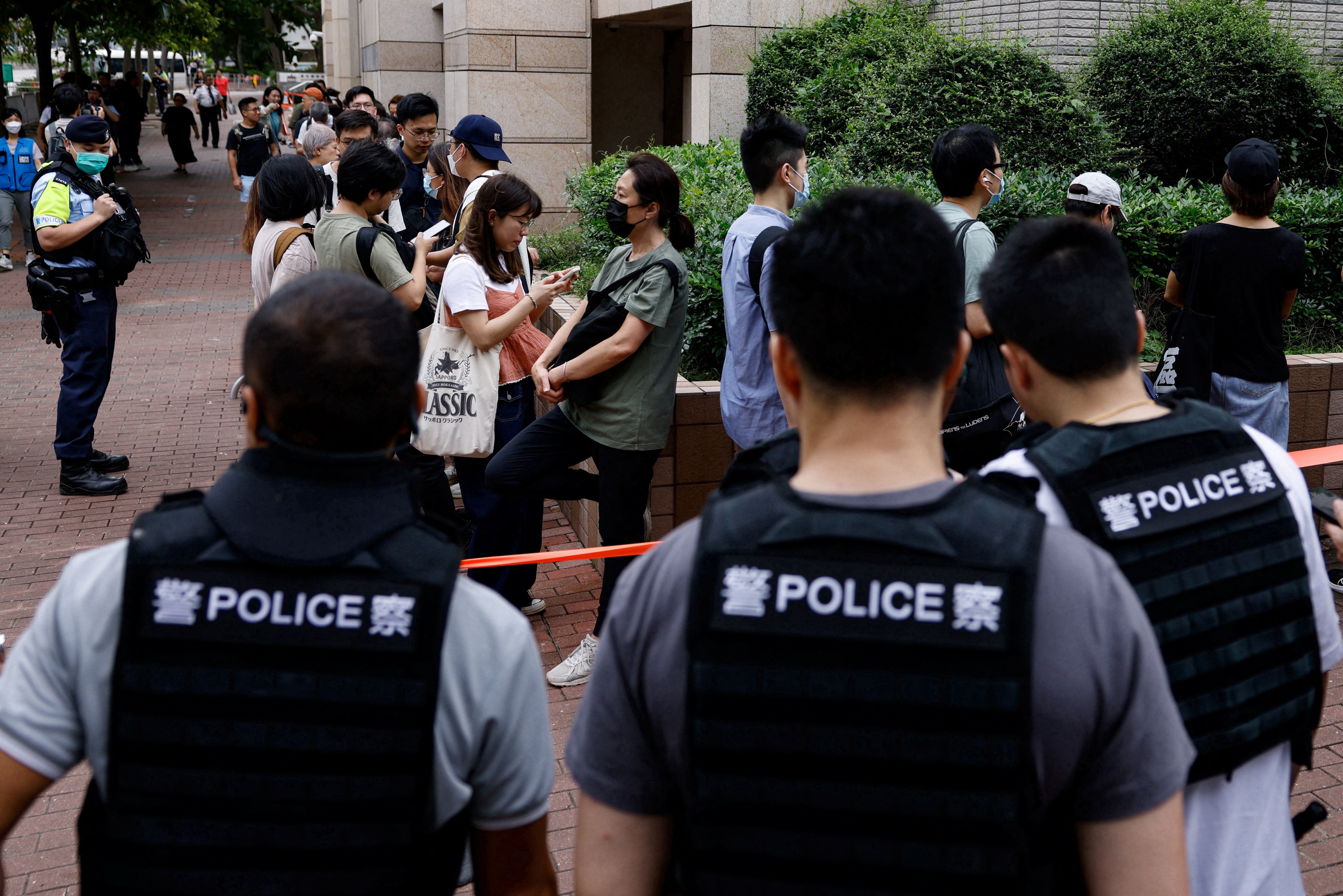 People lining up outside the West Kowloon Magistrates’ Courts building before the verdict
