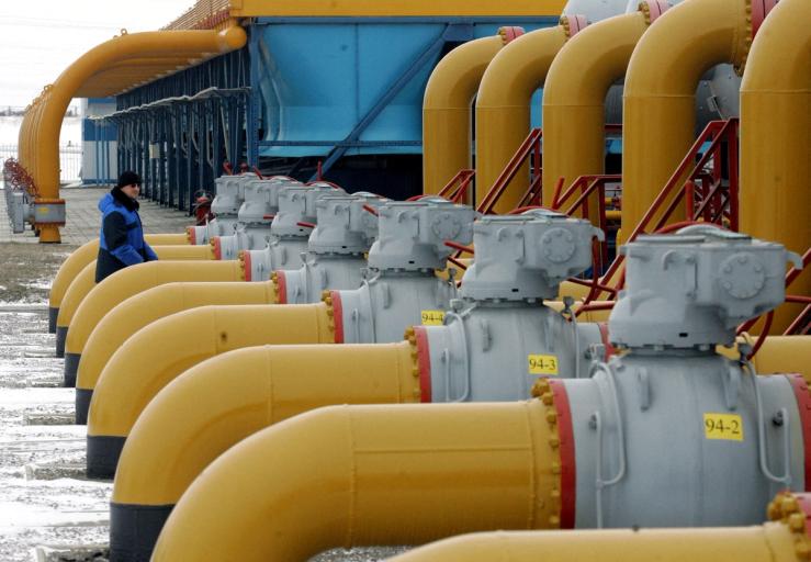 A gas worker walks between pipes in a compressor and distribution station of the Urengoy-Pomary-Uzhgorod gas pipeline near the Russian city of Kursk.