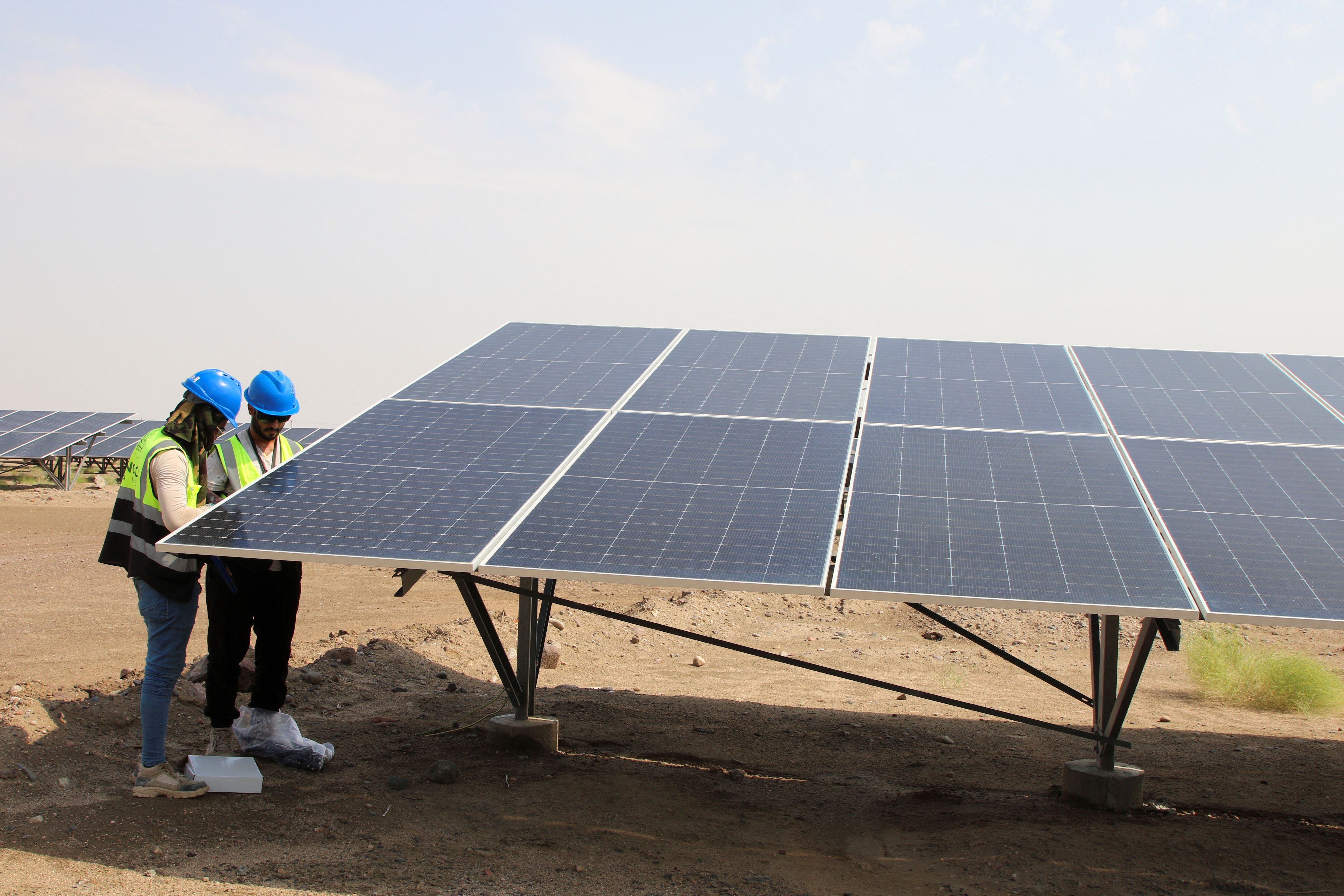 Solar panel installers in Africa. 