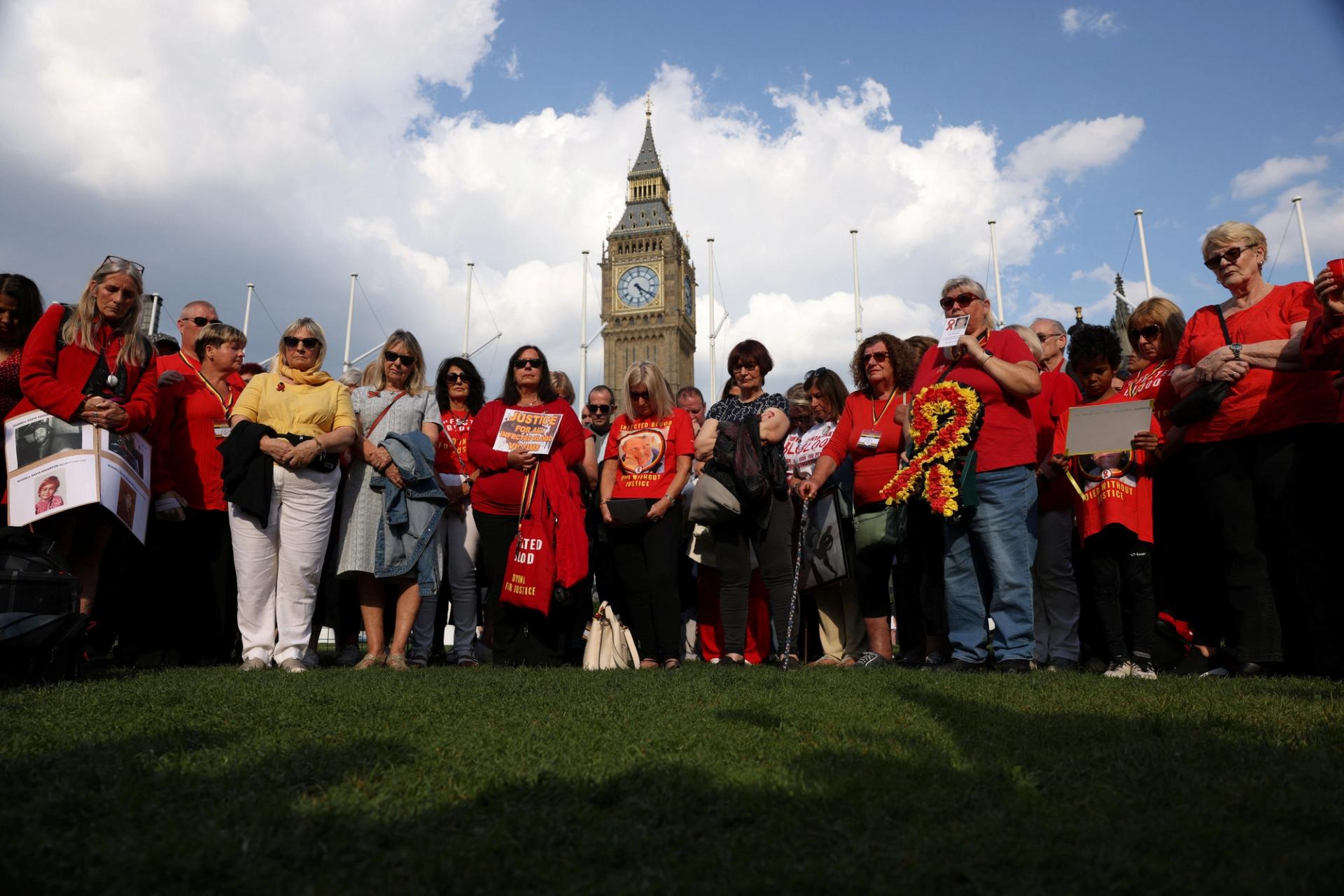 People impacted by the contaminated blood scandal participate in a minute of silence during a vigil to remember those that lost their lives, ahead of the release of final report of the Infected Blood Inquiry on Monday, in London, Britain, on May 19, 2024.
