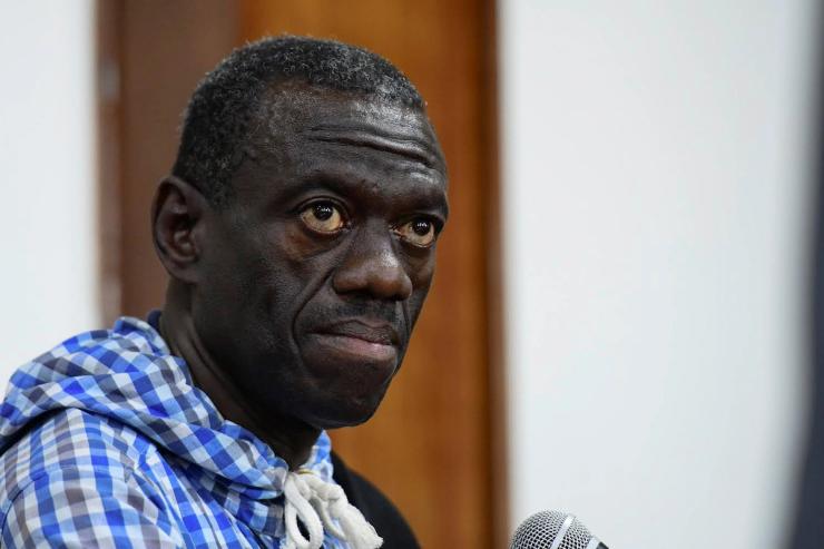 Veteran Ugandan opposition leader Kizza Besigye sits in the dock at the courtroom where he was charged with inciting violence during a protest in 2022.
