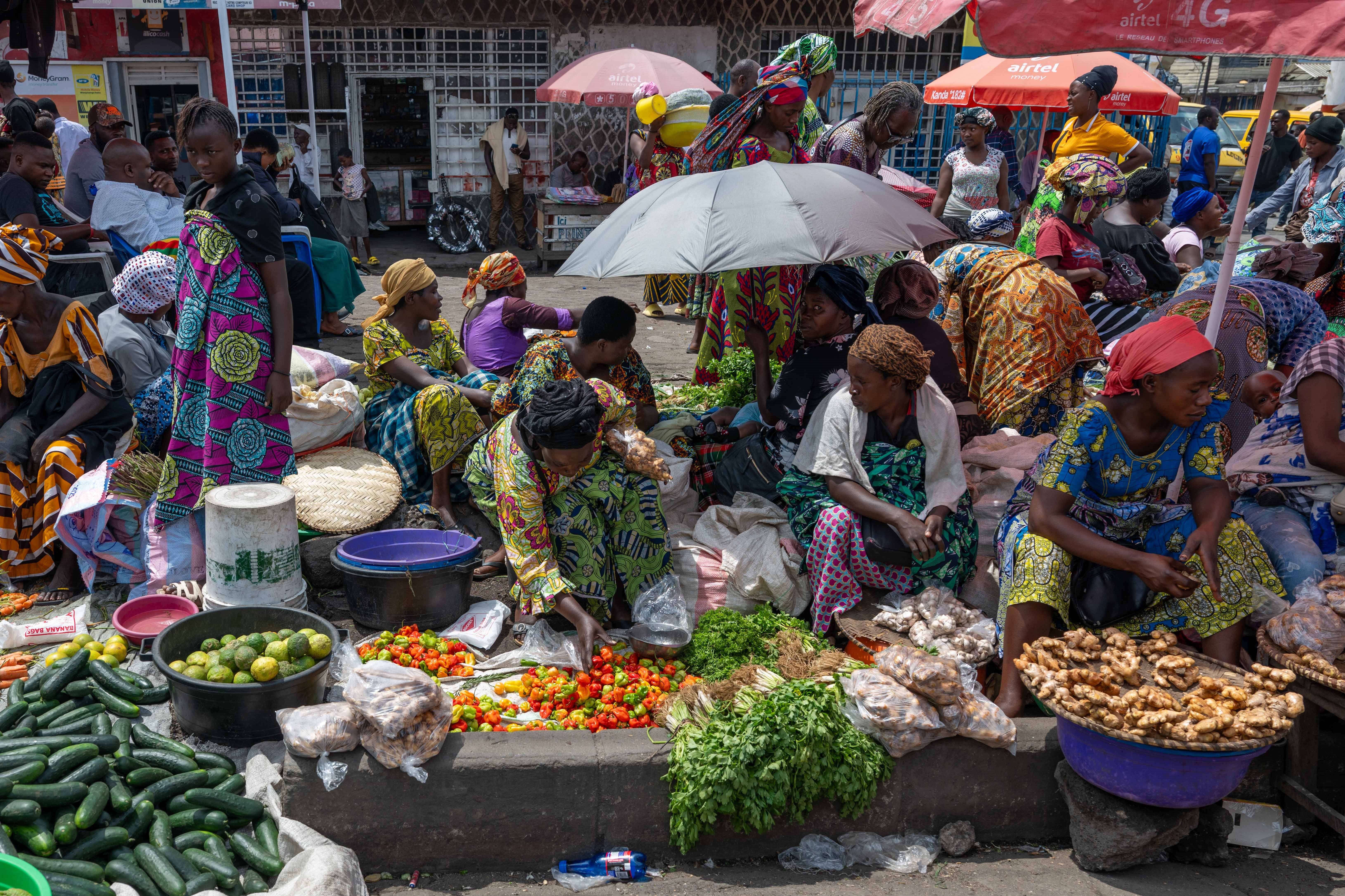 Vendors sell vegetables at a local market in Goma, DR Congo.