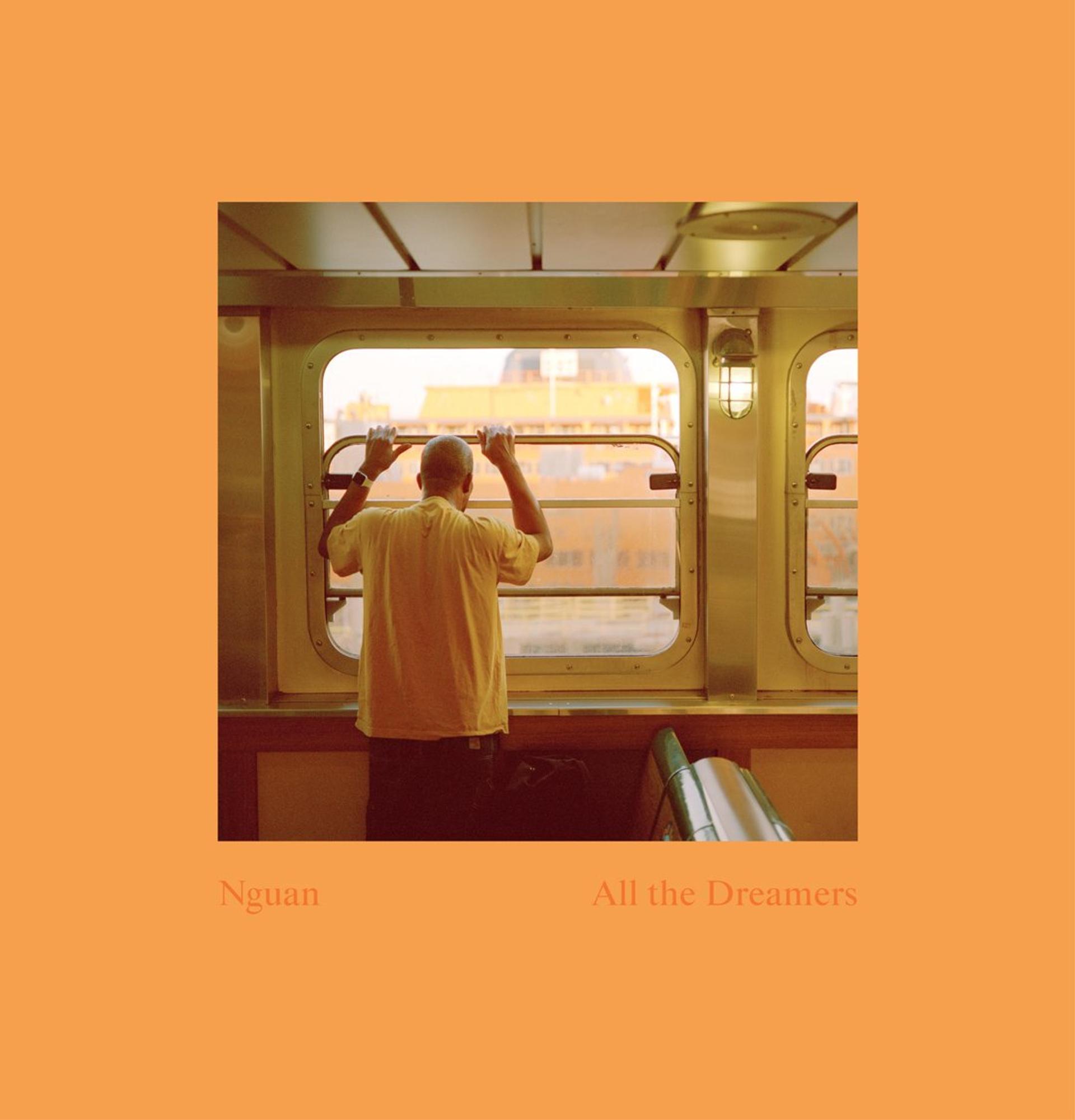 The cover of Nguan’s “All the Dreamers,” showing a man leaning against a window on the Staten Island Ferry. 