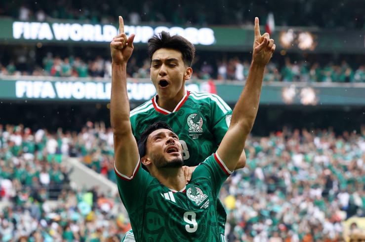 Mexican players celebrating a goal.