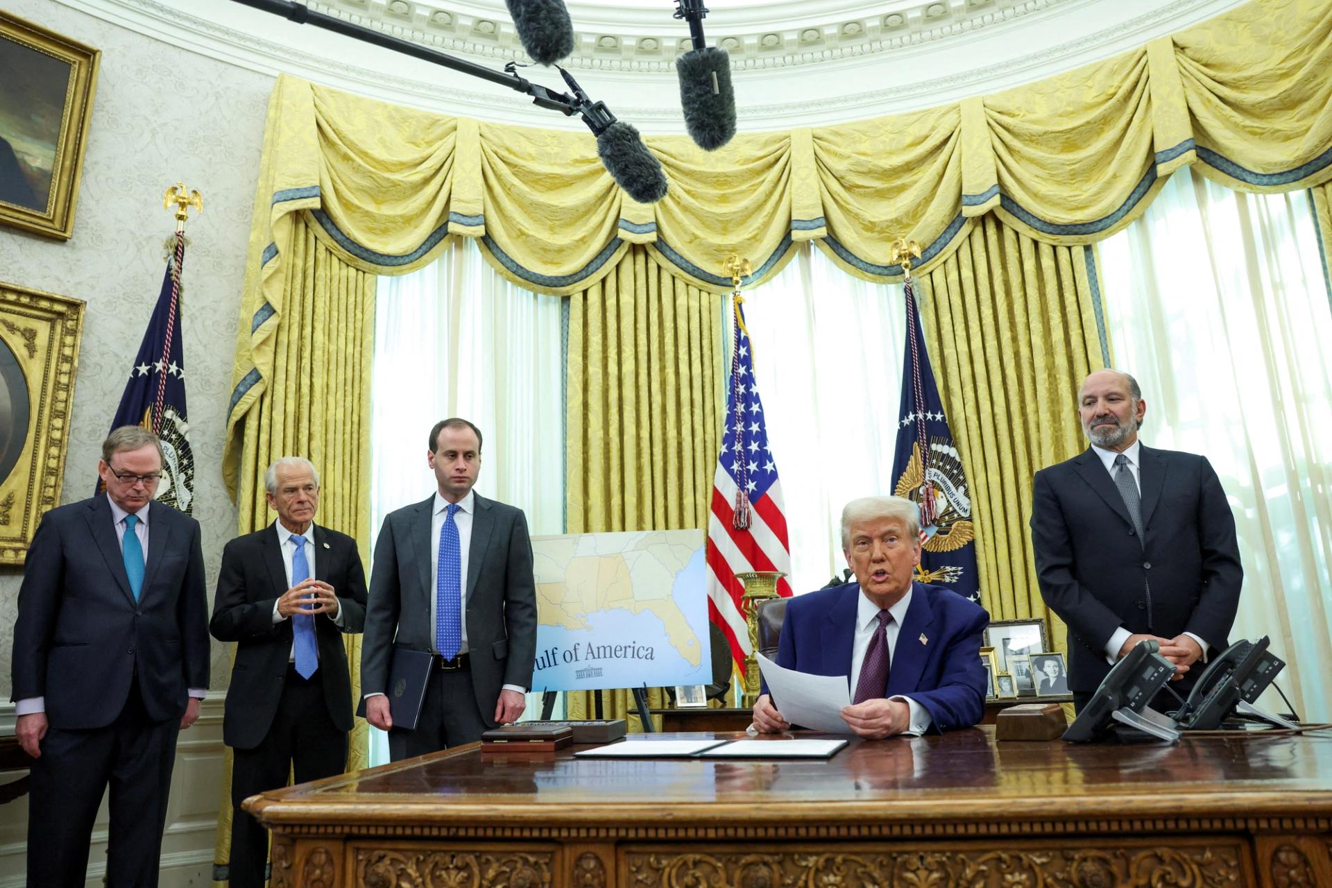 U.S. President Donald Trump speaks from the Oval Office of the White House, flanked by U.S. Commerce secretary Howard Lutnick, on the day he signs executive orders for reciprocal tariffs, in Washington.