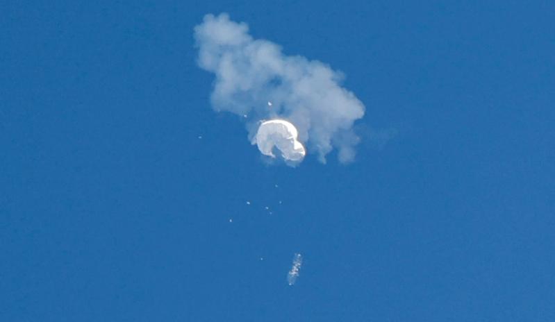 The suspected Chinese spy balloon drifts to the ocean after being shot down off the coast in Surfside Beach, South Carolina, U.S. February 4, 2023.