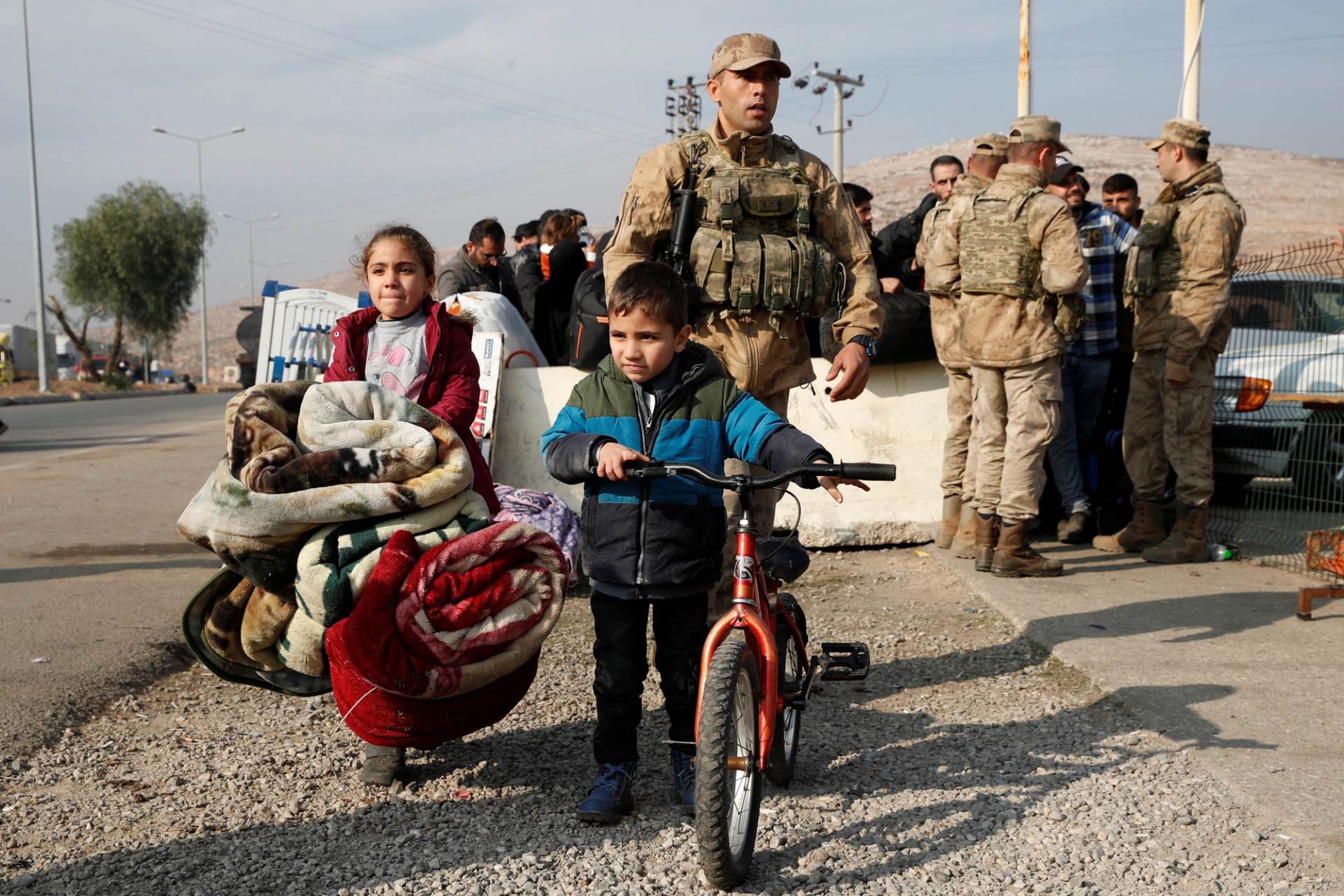 A few former asylum seekers waiting to cross back into Syria.