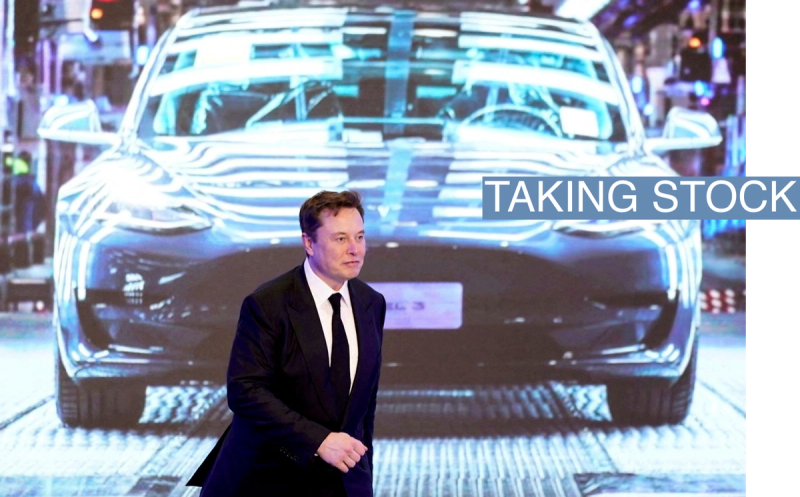 Tesla Inc CEO Elon Musk walks next to a screen showing an image of Tesla Model 3 car during an opening ceremony for Tesla China-made Model Y program in Shanghai, China January 7, 2020.