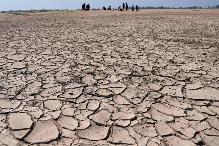 Greenpeace activists prepare a protest message over sandbanks exposed due to drought at the Solimoes River.